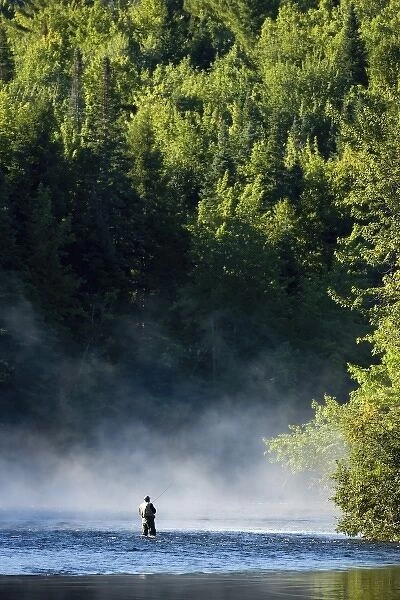 Fly-fishing in the early morning mist on the Androscoggin River just below the dam in Errol, NH