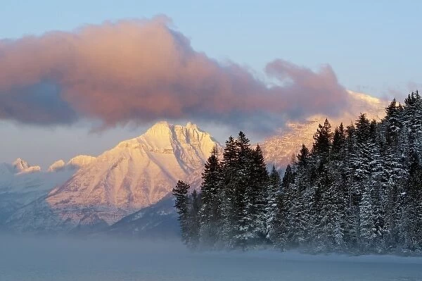 Fog rises from Lake McDonald on a very cold afternoon in Glacier National Park in Montana