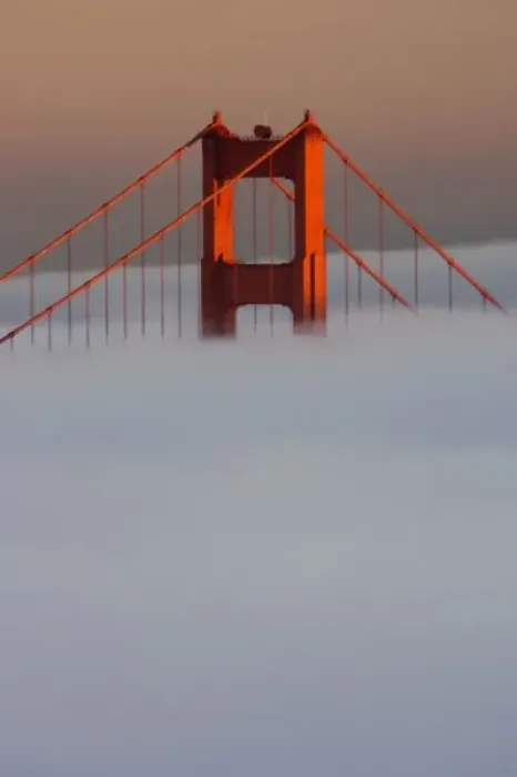 Framed Print : Fog rolls through the San Francisco bay covering the Golden Gate Bridge. Pictured
