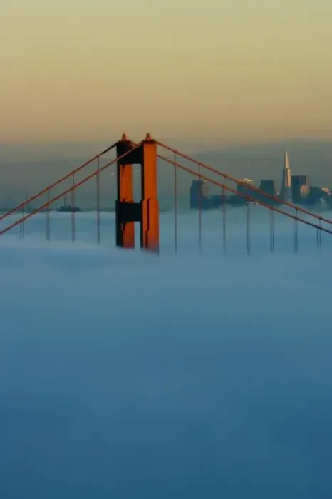 Framed Print : Fog rolls through the San Francisco bay covering the Golden Gate Bridge and city