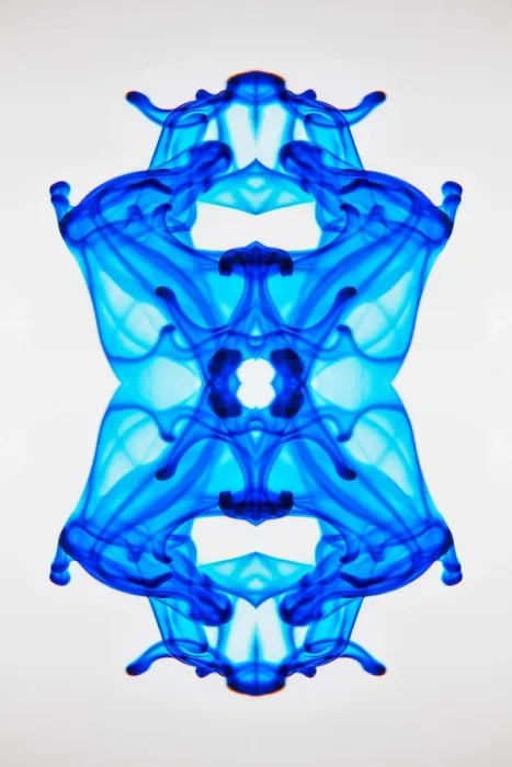 Framed Print : Food coloring dropped into glass of water and dispersing