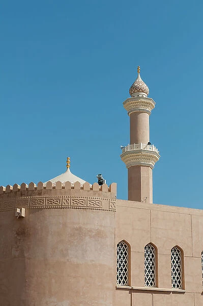 The fort of Nizwa. A scenic view of the fort at Nizwa, and its minaret. Nizwa, Oman