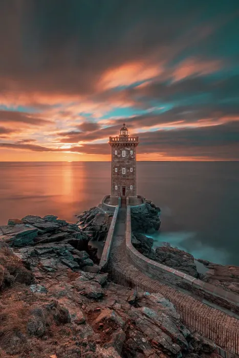 Framed Print : France, Brittany, Le Conquet. Sun setting at the Kermorvan Lighthouse