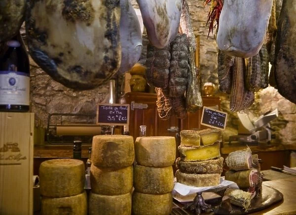 France, Corsica. Local cheeses and charcuterie (cured meats) at shop in Calvi offering