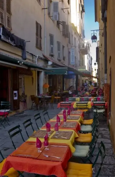 Framed Print : France, Corsica. Tables of cafe set up in narrow street in preparation for the evenings diners Framed Print : France, Corsica. Tables of cafe set up in narrow street in preparation for the evenings diners