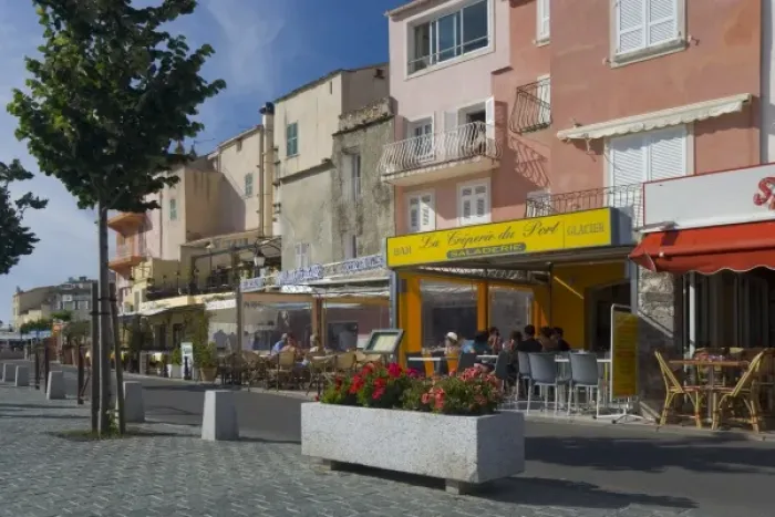 Framed Print : France, Corsica. Waterfront cafes and apartments in St. Florent Framed Print : France, Corsica. Waterfront cafes and apartments in St. Florent