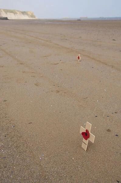 France, Normandy, Arromanches Beach. Remembrance crosses placed in the sand on the