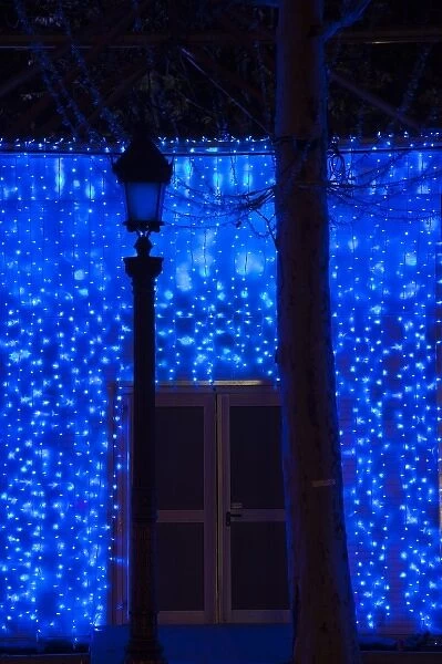 France, Paris, Champs Elysees, building covered in blue lights