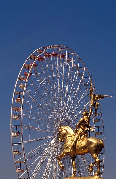 France, Paris, Jeanne d Arc statue and wheel. Rue de Rivoli
