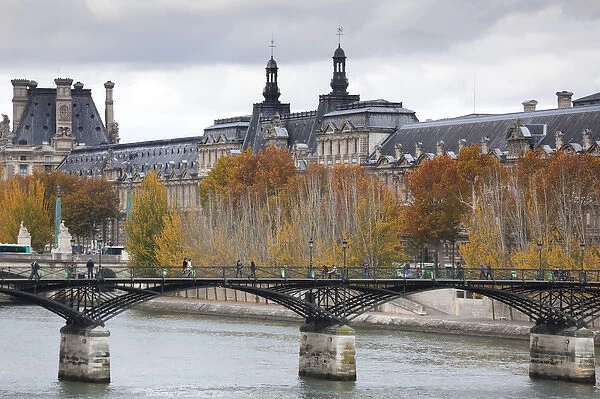 France, Paris, Musee de Louvre museum and Pont des Arts bridge