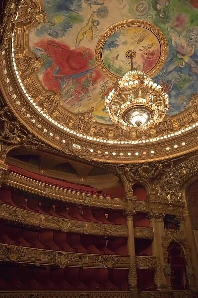 France, Paris. Part of ornate ceiling and tiers of seating at Opera Garnier
