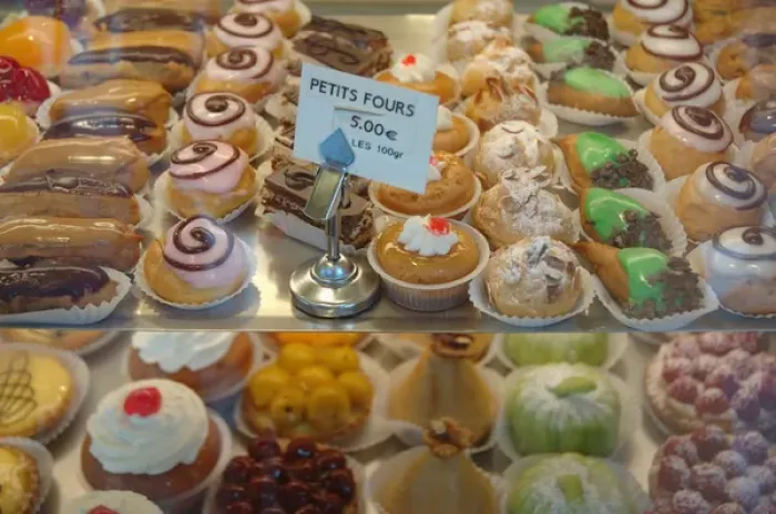 Framed Print : 03. France, Paris, petit fours in patisserie display window