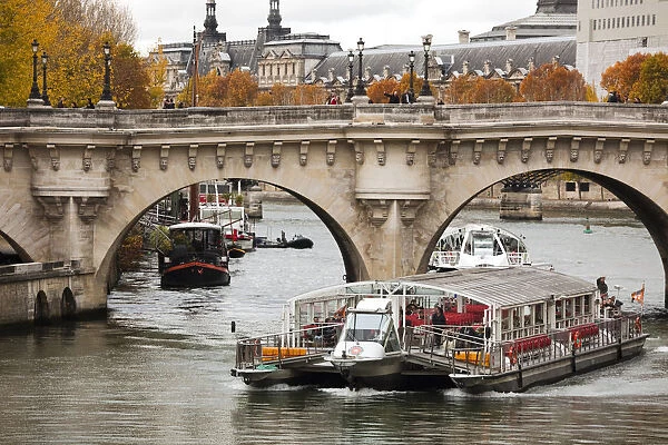 France, Paris, Pont Neuf bridge, Seine River and Bateau Mouche tourboat