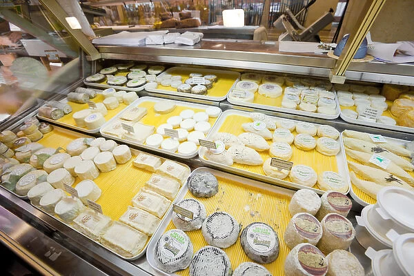France, Provence, Cannes. Cheeses on display for sale at market. Credit as: Fred