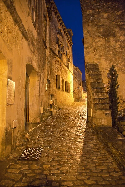 France, Provence, Les Baux-de-Provence. Deserted street inside castle at night. Credit as