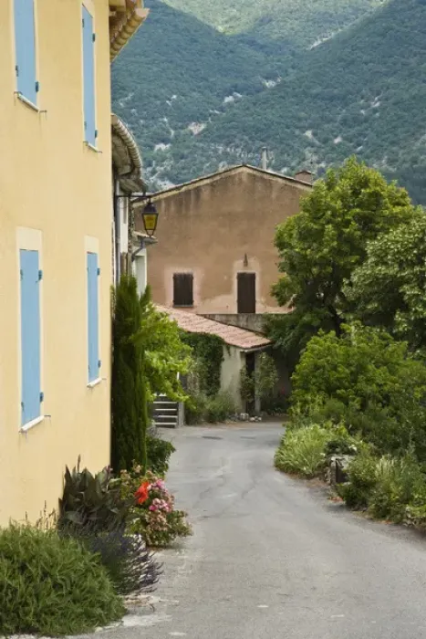 Framed Print : France, Provence. Road passing by houses Framed Print : France, Provence. Road passing by houses