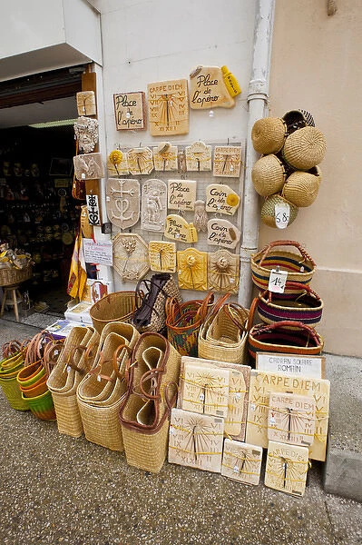 France, Provence, St. Remy-de-Provence. Wares on display outside souvenir shop. Credit as