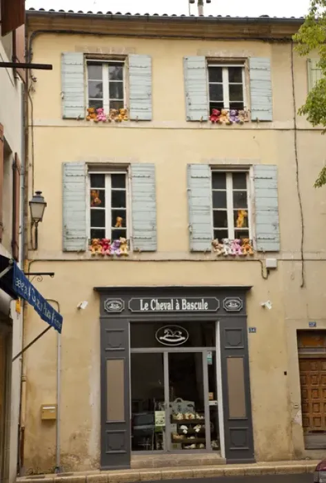 Framed Print : France, Provence, St. Remy-de-Provence. Colorful teddy bears on outside ledges of shop windows