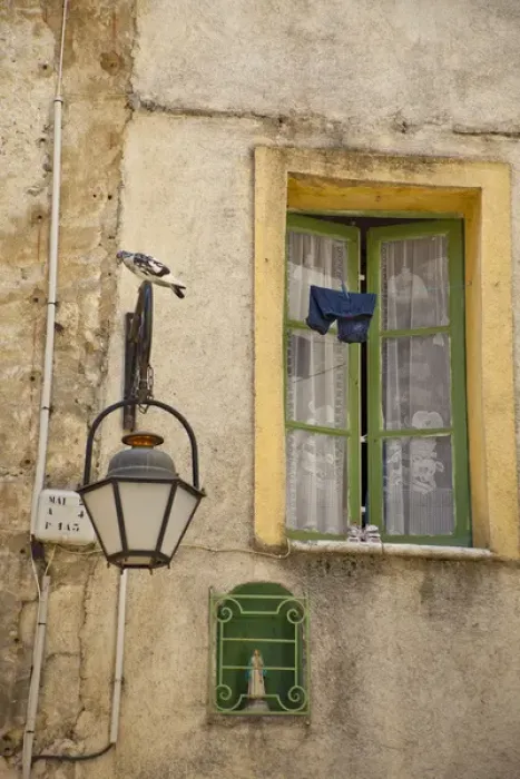 Framed Print : France, Provence, Vence. Childs trousers and shoes drying outside a homes window Framed Print : France, Provence, Vence. Childs trousers and shoes drying outside a homes window