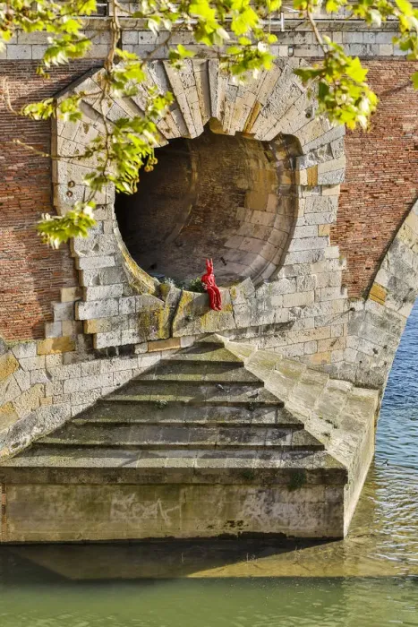 Framed Print : France, Toulouse. Red Devil sitting in opening of the Pont Neuf (Bridge) Framed Print : France, Toulouse. Red Devil sitting in opening of the Pont Neuf (Bridge)