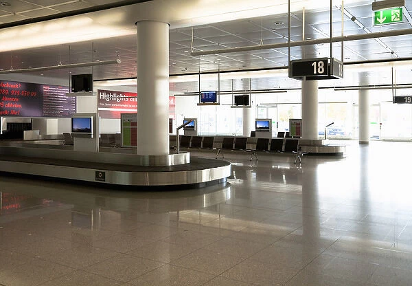 Frankfurt, Brandenburg, Germany - An empty baggage carousel in the arrivals section of an airport