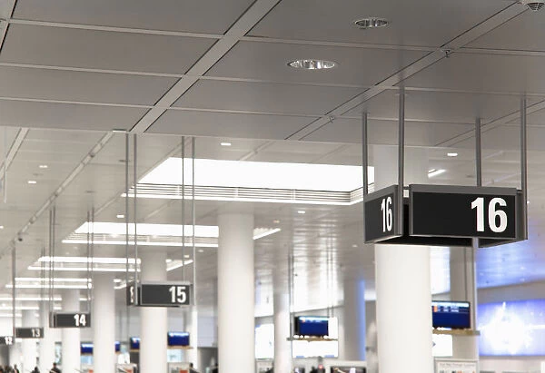 Frankfurt, Brandenburg, Germany - Gate numbers are hanging from the ceiling in an airport