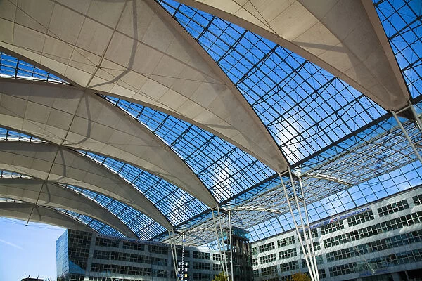 Frankfurt, Brandenburg, Germany - An open air area covered by glass and fabric in an airport