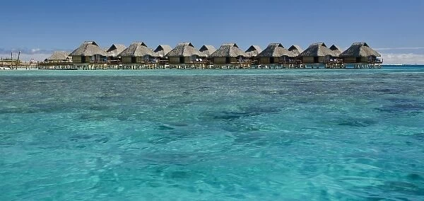 French Polynesia, Bora Bora. Over-water bungalows with grass thatched roofs