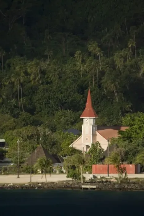 Framed Print : French Polynesia, Society Islands, Bora Bora. A red-roofed church at the waters edge