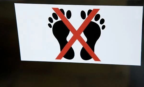 French Polynesia, Society Islands, Tahiti, Papeete. An international sign meaning No Bare Feet