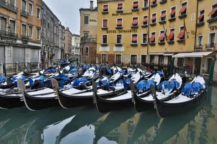 Framed Print : Fresh snow on Gondolas along the canals of Venice, Italy Framed Print : Fresh snow on Gondolas along the canals of Venice, Italy