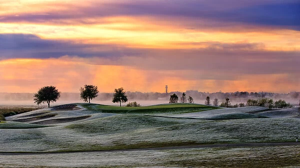 Frosty morning golf and sunrise sky