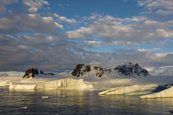 frozen glacial mountain landscape along the western Antarctic peninsula, Antarctica