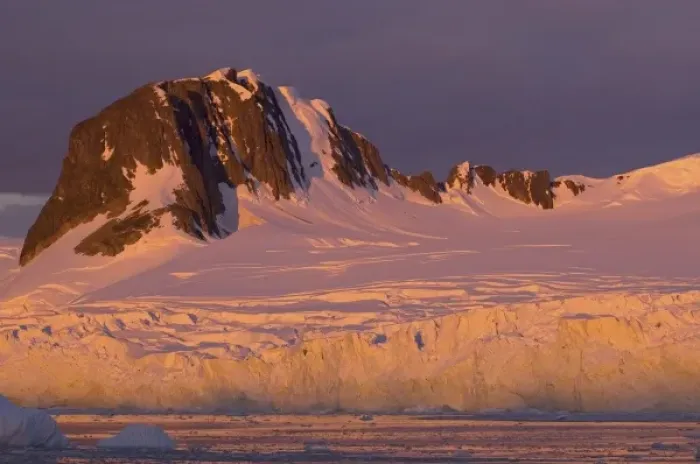 Framed Print : frozen glacial mountain landscape along the western Antarctic peninsula at sunset