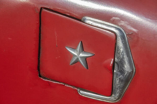 Detail of gasoline tank door with star on classic American car in Vieja, old Habana