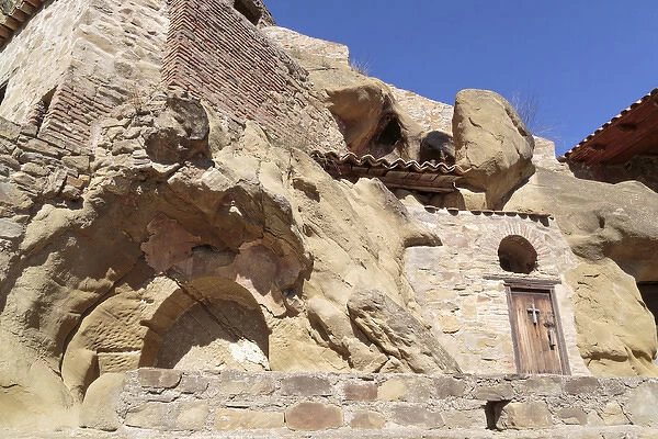 Georgia, Kakheti. Buildings built into a rockface at the David Gareja Monastery