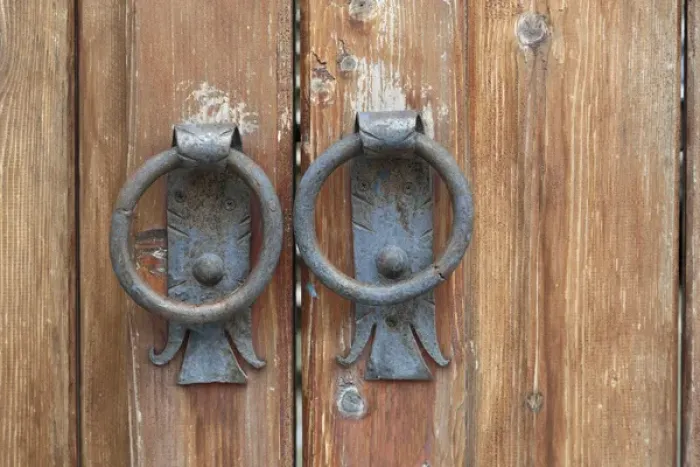 Framed Print : Georgia, Mtskheta. A close view of worn handles on a wooden gate
