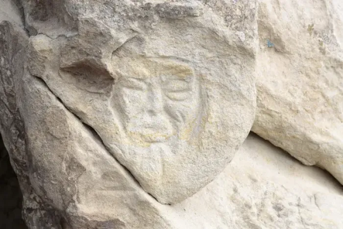 Framed Print : Georgia, Uplistsikhe. A face carved into a stone wall
