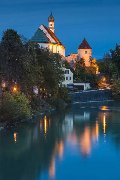 Germany, Bavaria, Fussen, Franciscan Abbey church and Lech River, evening