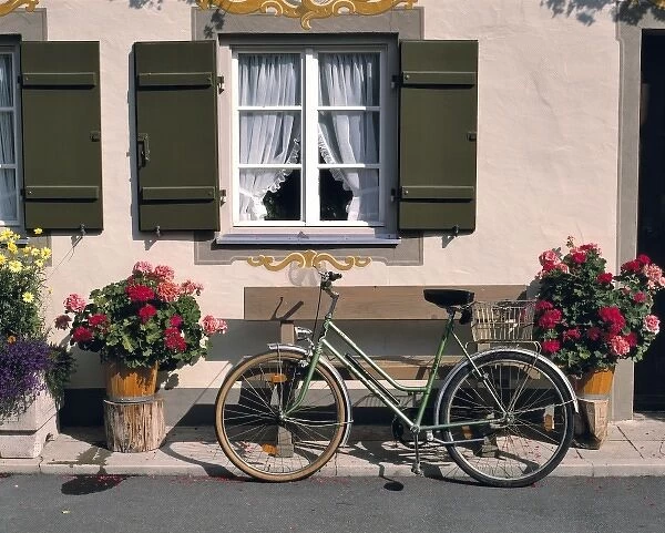 Germany, Bavaria, Obergammergau. A bicycle awaits its rider outside a shop in Oberammergau