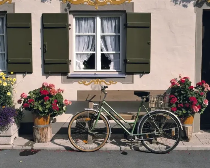 Framed Print : Germany, Bavaria, Obergammergau. A bicycle awaits its rider outside a shop in Oberammergau