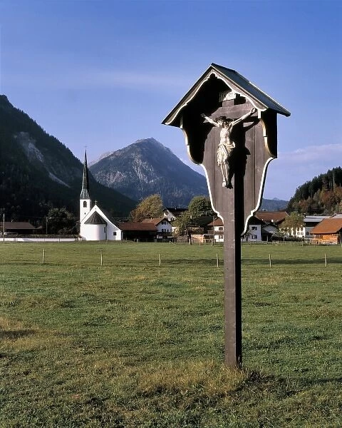 Germany, Bavaria. A roadside shrine marks the entrance to a village in Bavaria, Germany
