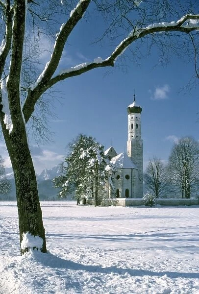 Germany, Bavaria, St. Colomans Church. A sparkling white and blue winter comes