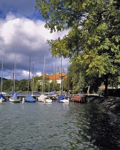 Germany, Bavaria, Tegernsee. Sail boats are covered against inclement weather near