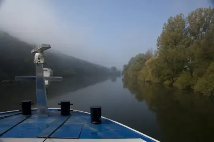 Framed Print : Germany, Franconia. Cruising along the Main River near Wertheim with early morning fog