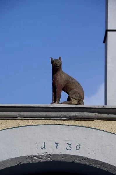 Germany, Franconia, Rothenburg. Cat statue on historic wall, c. 1730