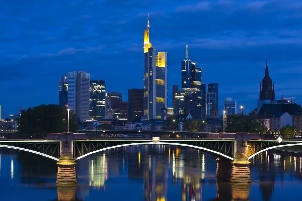 Germany, Hessen, Frankfurt am Main. Skyline from Main River and Ignatz Bubis Brucke bridge, dawn