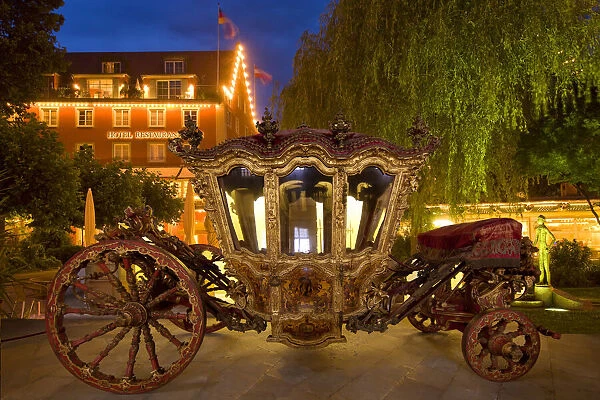 Germany, Lindau Island, Lake Constance. Victorian ornate carriage in front of hotel at