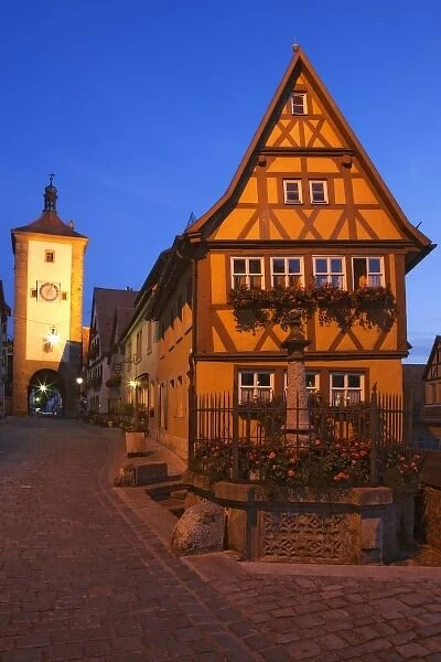 Germany, Rothenburg. Siebers Tower with clock guards entrance to the town