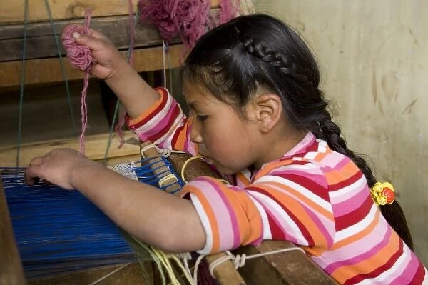 Girl (age 9) weaving at loom, Huaripampa (near Huaraz), Peru. (MR)